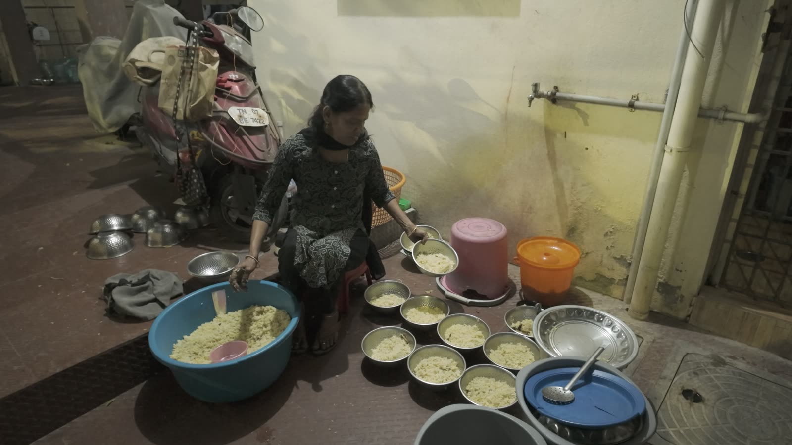 Cynthia preparing the night feed across her kitchen floor